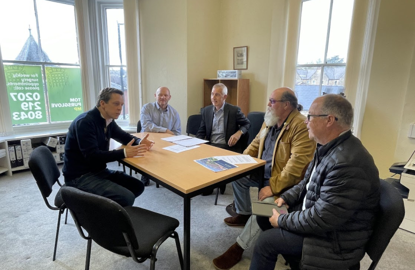 Tom in discussion with councillors, campaigners and the developers of Kettering Energy Park in his constituency office.