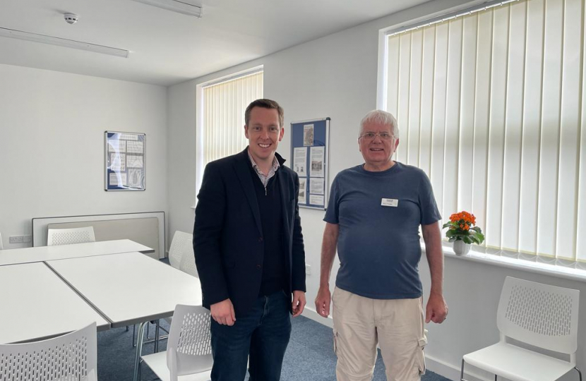 Tom stood with a volunteer from Thrapston Library in the library's new community meeting room.