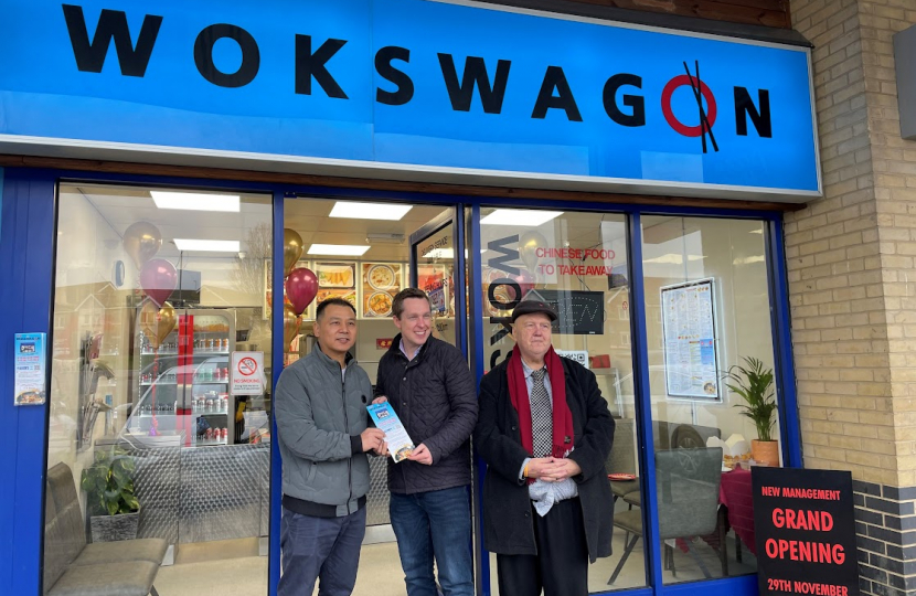 Tom Pursglove MP and two representatives outside of the newly reopened Wokswagon, Oakley Vale.