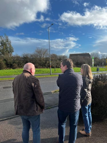 Tom and two constituents in discussion while looking at the proposed site for the 5G Mast.