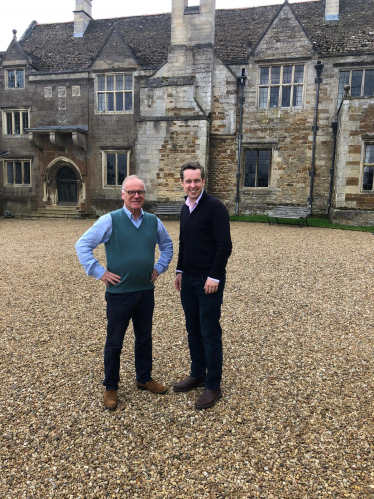 Tom stood next to James Saunders-Watson in front of Rockingham Castle
