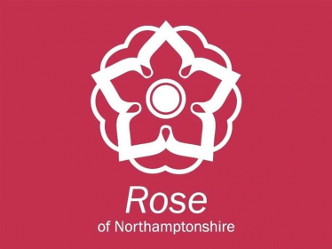 Rose of Northamptonshire Logo - a white rose on a red background with the text below 'Rose of Northamptonshire'